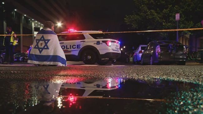 A man with an Israeli flag reading from the Torah in Northwest D.C. on May 21, 2025, after federal officials confirmed two people were fatally shot while leaving an event at the Capital Jewish Museum. (7News)