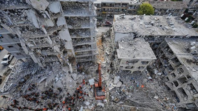 Israeli soldiers search through the rubble of residential buildings destroyed by an Iranian missile strike in Bat Yam, central Israel, on Sunday, June 15, 2025. (AP Photo/Baz Ratner)