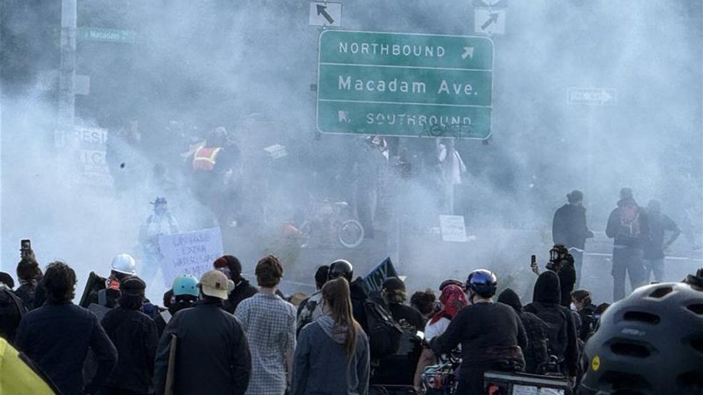 Image for story: Portland Police declare protest outside ICE facility a riot