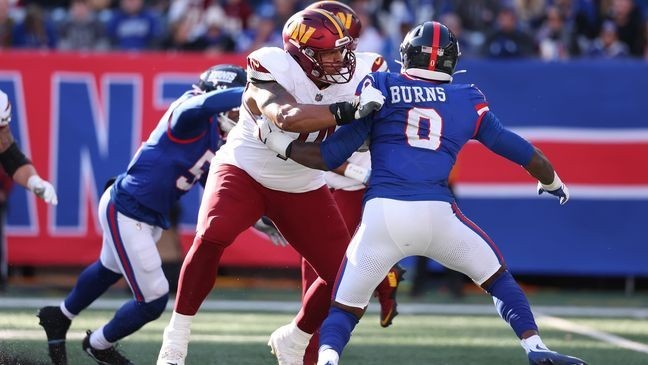 EAST RUTHERFORD, NEW JERSEY - NOVEMBER 03: Brandon Coleman #74 of the Washington Commanders in action against Brian Burns #0 of the New York Giants during their game at MetLife Stadium on November 03, 2024 in East Rutherford, New Jersey. (Photo by Al Bello/Getty Images)