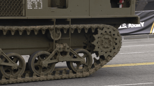 Soldiers ride on military tanks during the Army's 250th birthday celebration and parade in D.C. (7News/Kimi Flemming){p}{/p}