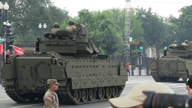 Soldiers ride on military tanks during the Army's 250th birthday celebration and parade in D.C. (7News/Kimi Flemming){p}{/p}
